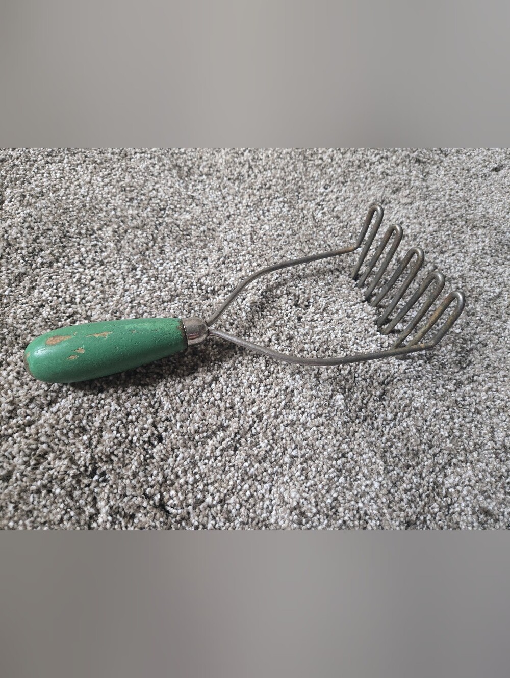 green handle potato masher